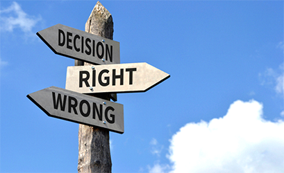 Street signs saying decision, right, wrong